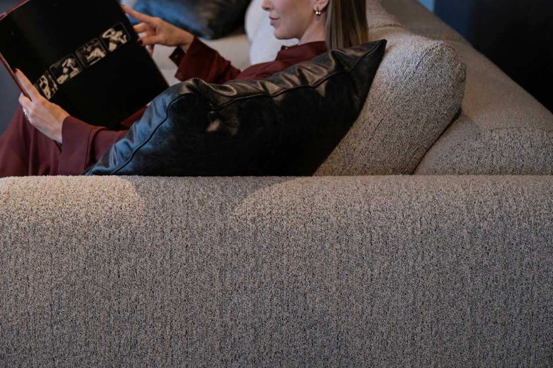 person reading mystery novel at home